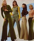 Four women in 1970s outfits smiling and standing together for an apparent magazine advertisement